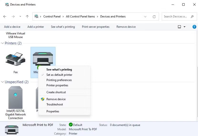 How to set a default printer in Windows from the right-click menu. Screenshot showing how to set a printer as the default in Windows: A right-click context menu is open on a selected printer icon, with the option 'Set as default printer' highlighted.